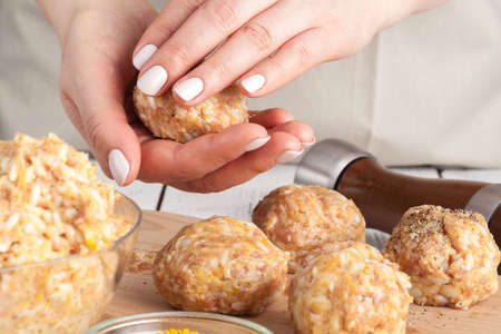 Cooking diet chicken meatballs for healthy dinnerの写真素材