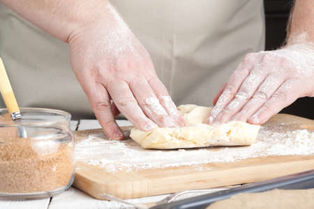 hands making dough on kitchen, close up viewの写真素材