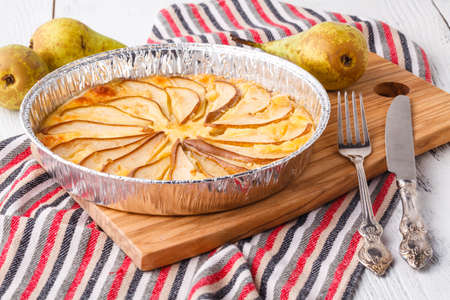 Puff pastry pies with cheese and pear in a plateの写真素材
