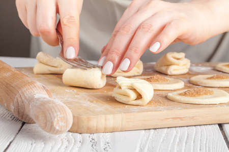 Baking christmas cookies on brown wooden tableの写真素材