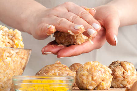 Cooking diet chicken meatballs for healthy dinnerの写真素材
