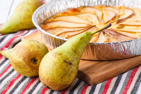 Puff pastry pies with cheese and pear in a plateの写真素材