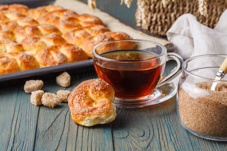 Tea and cookies on wooden tableの写真素材