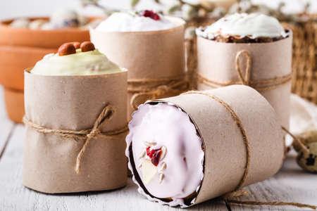 Easter composition with orthodox sweet bread, kulich and eggs on light background. Easter holidays breakfast conceptの写真素材