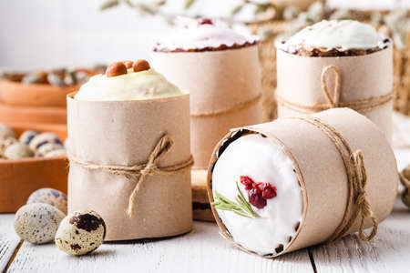 Plates with sweet Easter cakes on tableの写真素材