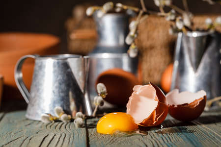 Prepare dough for making homemade dumplings or noodles on a brown wooden table in a rustic kitchenの写真素材