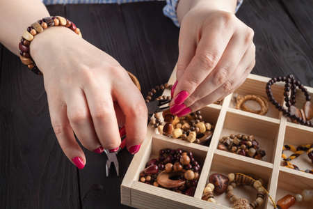 Homemade jewelry. Woman making home craft art bijouterieの写真素材