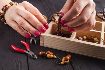 Free time evening making beads. Woman leisure home work, masterclass conceptの写真素材