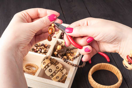 woman process hand made design freelance work at home make accessories earrings, ornaments,の写真素材