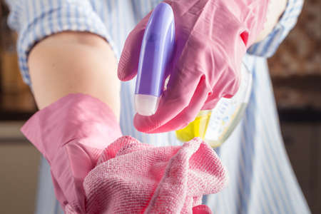 Washing the windows in the house with a rag and a spray for cleaning glasses. Cleaning the houseの写真素材