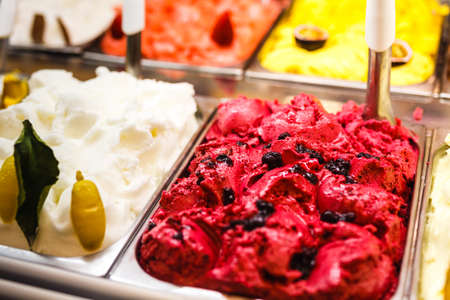 italian gourmet gelatto ice cream display in shop windowの写真素材