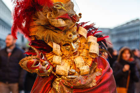 VENICE, ITALY â€“ FEBRUARY 17, 2019: People in carnival costumes on Piazza San Marco in Venice...