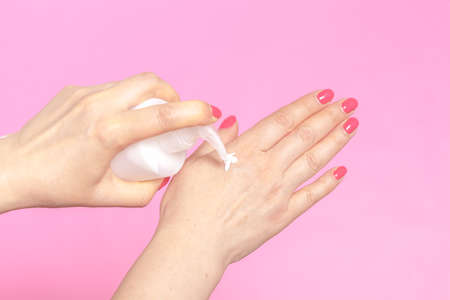 Closeup of female hands applying hand cream.Hand Skin Careの写真素材