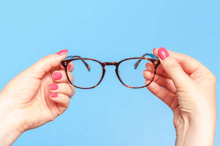 modern reading glasses. Woman is taking  optics spectaclesの写真素材