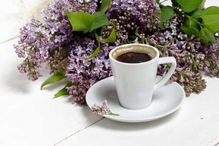 Coffee for Breakfast and lilac flowers. Selective focusの写真素材