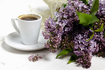 Coffee for Breakfast and lilac flowers. Selective focusの写真素材