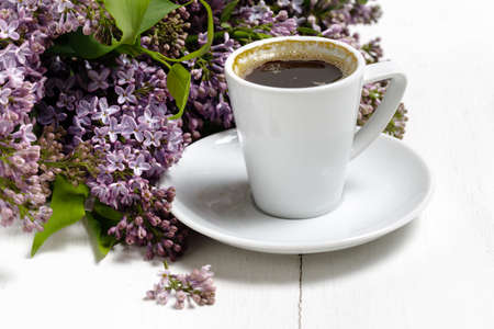 Coffee for Breakfast and lilac flowers. Selective focusの写真素材