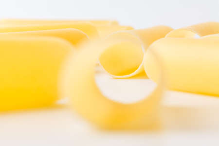 Dry Conchiglie pasta close up on whiteの写真素材