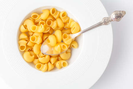 Pile of raw elbow Macaroni (Gomiti Pasta)の写真素材