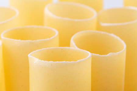 Dry Conchiglie pasta close up on whiteの写真素材