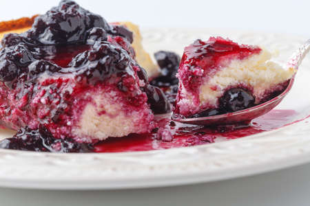 Cozy breakfast with a peace of berry cheesecakeの写真素材