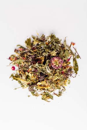 Invigorating Green Tea pineapple pieces, rosehip, slices of apple, cherry, strawberry, marigold petals and rosesの写真素材