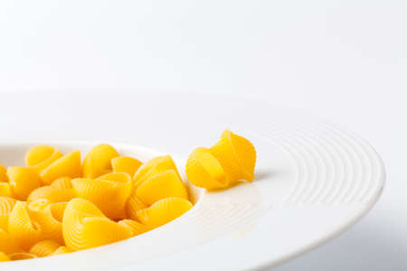Pile of raw elbow Macaroni (Gomiti Pasta)の写真素材