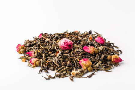 Black dry tea with fruits and petalsの写真素材