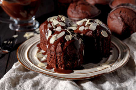 Chocolate muffins on the table, dark backgroundの写真素材
