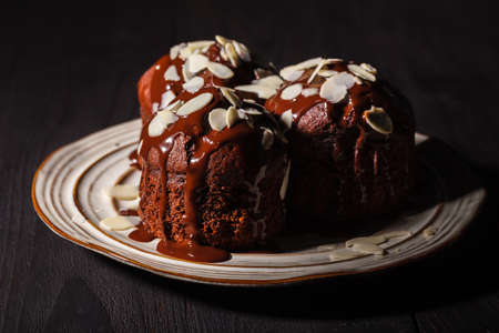 chocolate muffins on a wooden backgroundの写真素材