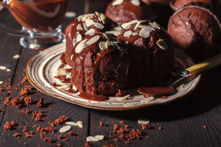 chocolate muffins on a wooden backgroundの写真素材