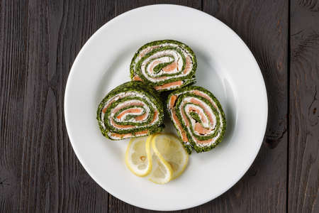 Spinach rolls with smoked salmon and cream cheeseの写真素材