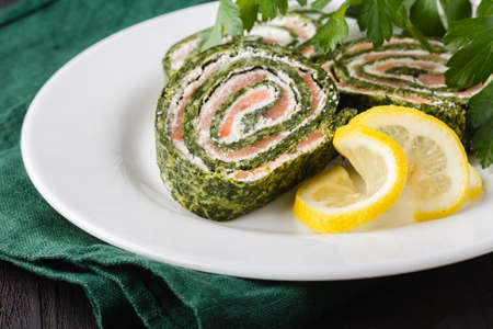 Roll salted salmon, cream cheese and spinachの写真素材