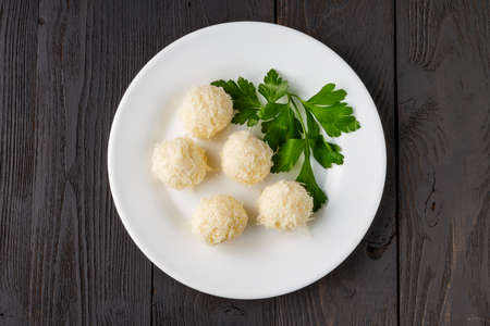 Cheese balls in crab shavings is a traditional Russian snack for Christmas and New Year's partyの写真素材