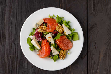 salad with grapefruit, arugula and cheeseの写真素材