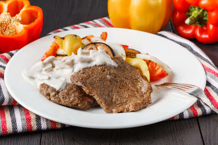 Grilled steaks and vegetable saladの写真素材