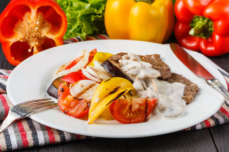 Barbecue dish. Beef steak and grilled vegetablesの写真素材
