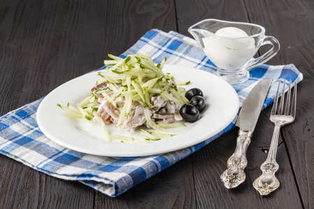 potato salad with cucumber and radish dressed with mustardの写真素材