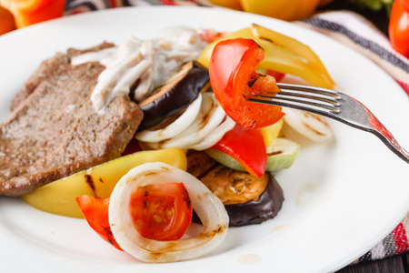 Grilled beef steak and baked vegetablesの写真素材