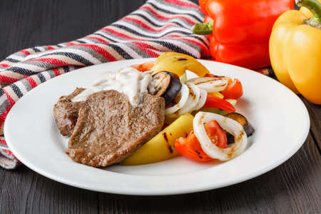 Grilled beef steak and baked vegetablesの写真素材