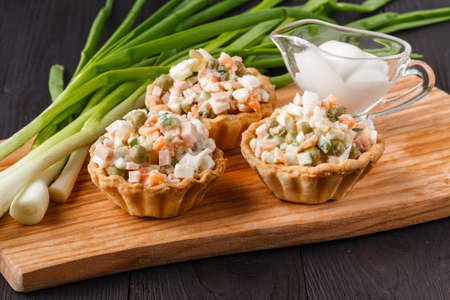 snack with ham, cheese, pepper and tomato in tartlets. Square. Concept of food, restaurant, catering, menuの写真素材