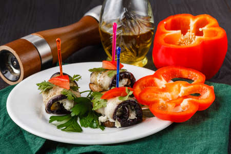 Grilled eggplants rolls with cream cheese, garlic and herbsの写真素材