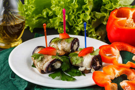 Grilled eggplants rolls with cream cheese, garlic and herbsの写真素材