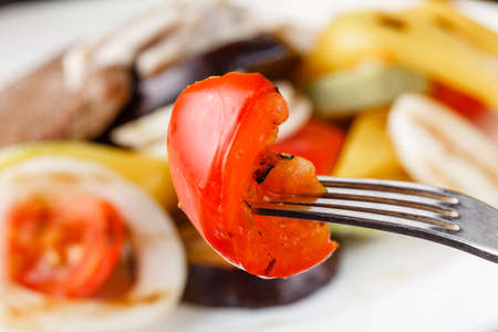 Grilled meat steak with vegetables in a plateの写真素材