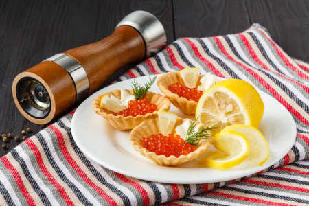 Tartlets with cheese and red caviar. Selective focusの写真素材