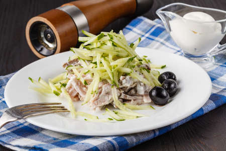 potato salad with cucumber and radish dressed with mustardの写真素材