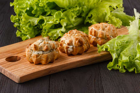 snack with ham, cheese, pepper and tomato in tartlets. Square. Concept of food, restaurant, catering, menuの写真素材