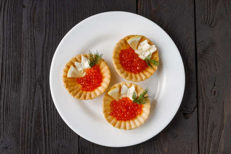 Tartlets with cheese and red caviar. Selective focusの写真素材
