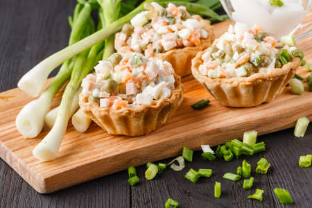 snack with ham, cheese, pepper and tomato in tartlets. Square. Concept of food, restaurant, catering, menuの写真素材