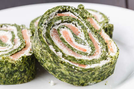 Roll salted salmon, cream cheese and spinachの写真素材
